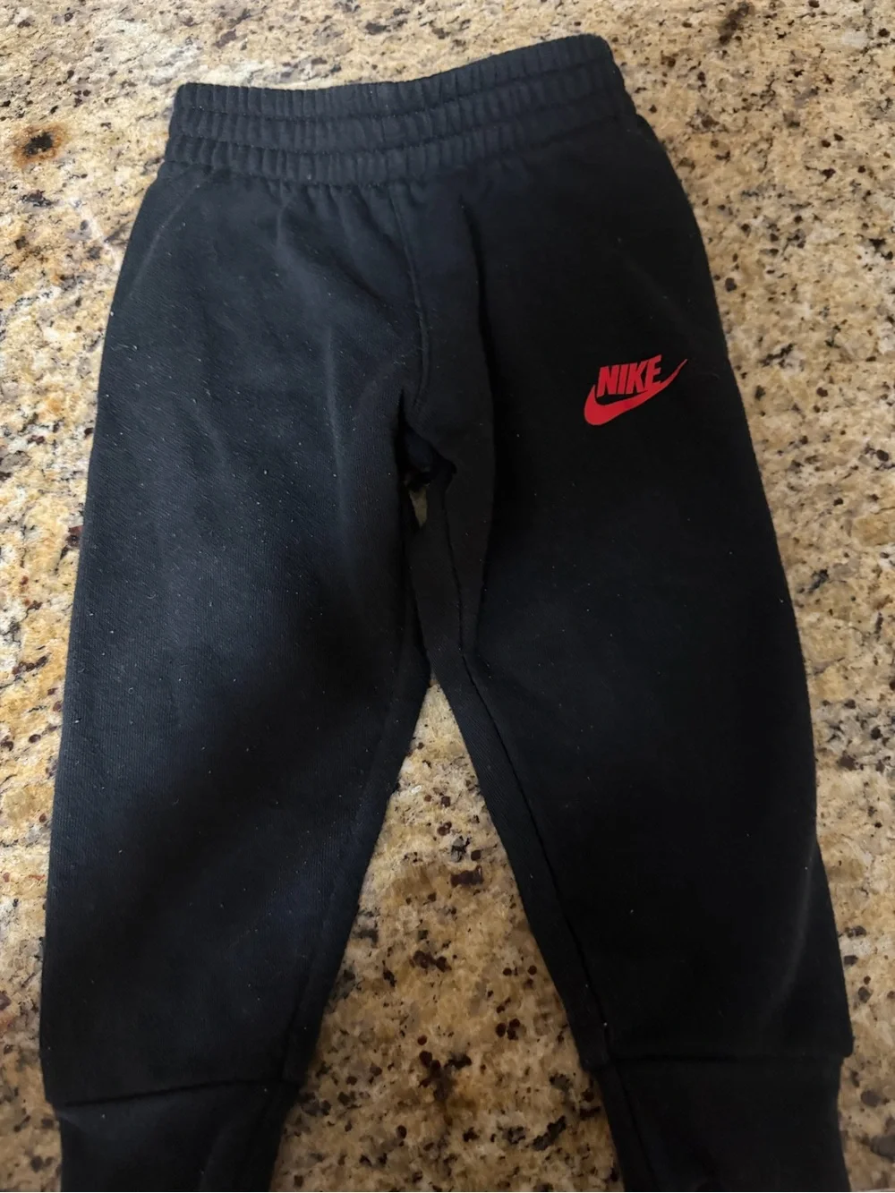Nike Black Kids Sweatpants with Red Swoosh Logo